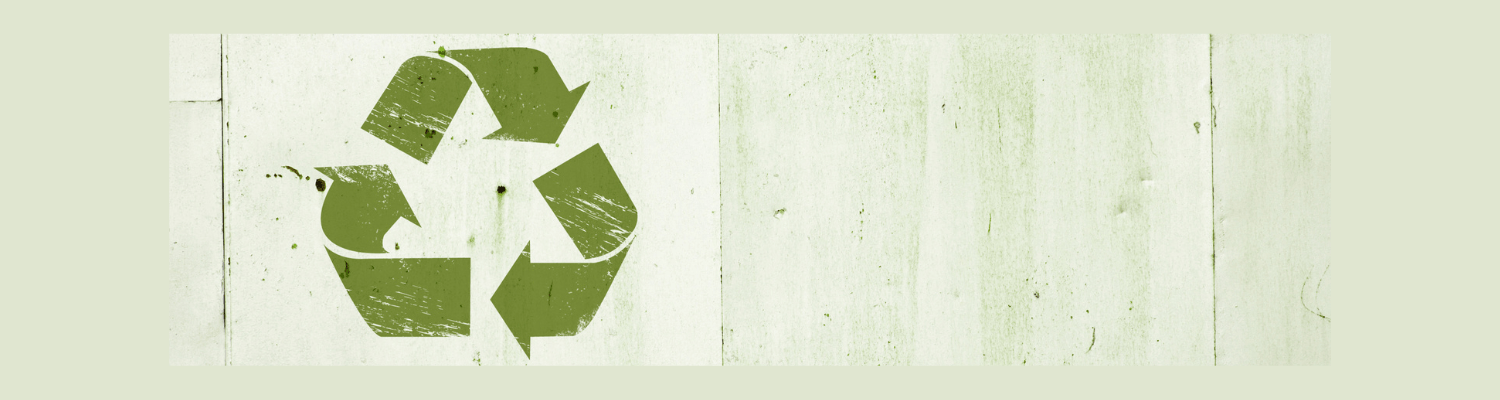 Recycle Sign over a green background